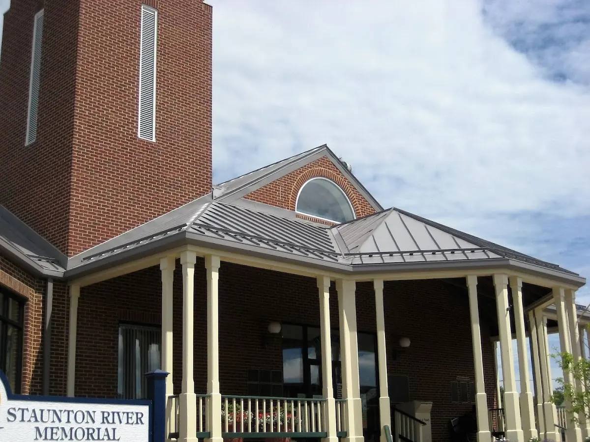 Skilled roofing craftsmen working on a residential roof in Virginia Heights